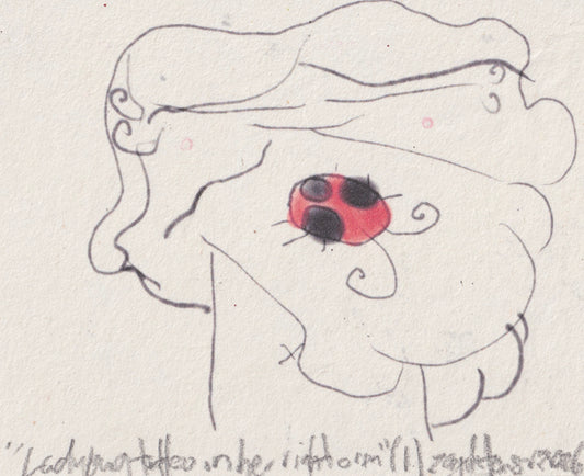 Ladybug tattoo on her right arm